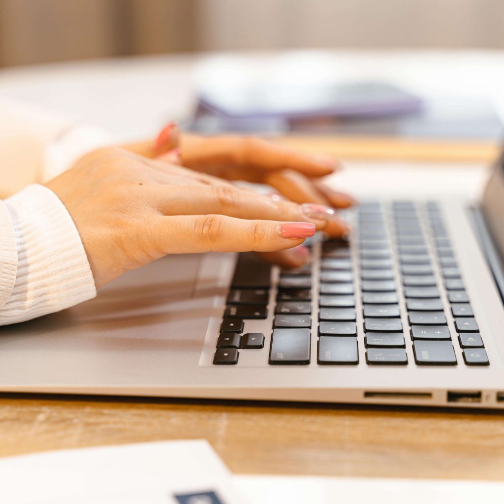 An individual with long pink nails typing away on a laptop keyboard. If you have BCBS or Viva insurance, explore our mental health services in Alabama here. Get support for the whole family.
