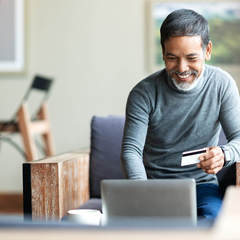 man holding insurance card | alabaster therapy | therapy in alabaster, al | counseling gardendale, al | best therapist Birmingham, al | gardendale, al | alabaster, al | pelham, al | clanton, al | calera, al A mature man with a beard looking at his laptop while holding an insurance card. Representing how IHS accepts insurance for therapy. Explore the counseling services in Pelham, Calera, Clanton, and surrounding areas.